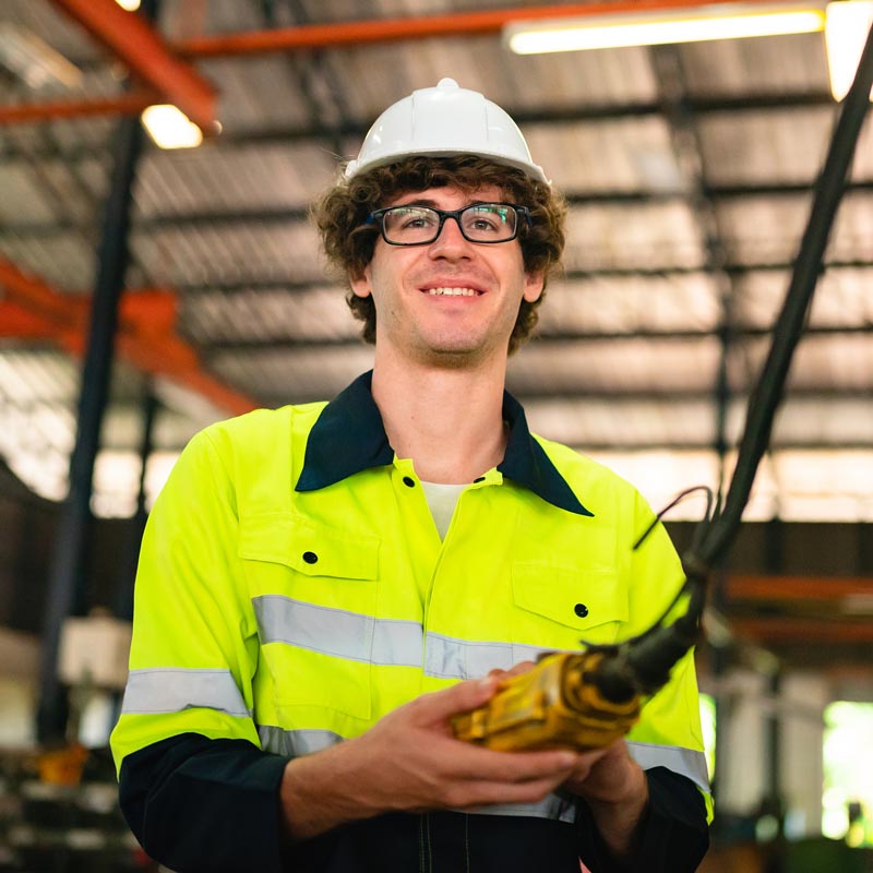A smiling worker in a factory