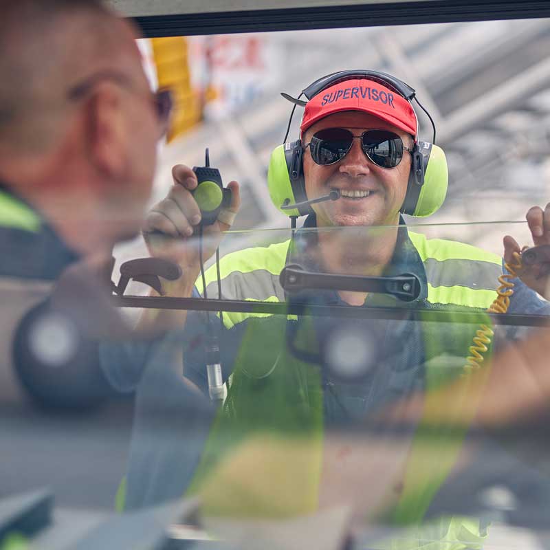 A smiling worker in a factory